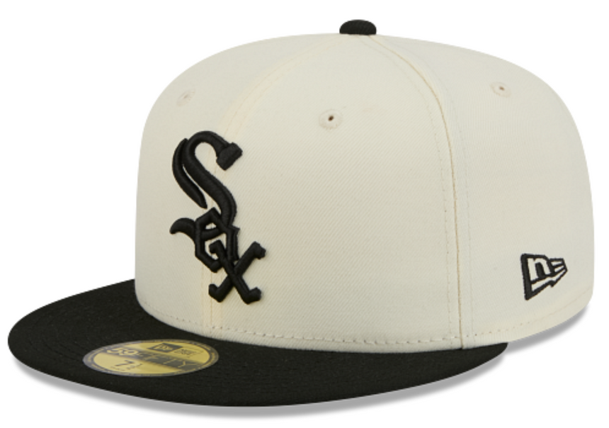 A New Era 59FIFTY fitted baseball cap in off-white and black, featuring the Chicago White Sox logo on the front and a black flat brim.