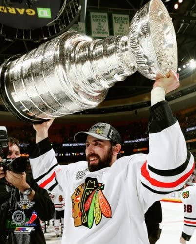 Nick Leddy Chicago Blackhawks 2013 Stanley Cup Champions Raising Of The Cup Photo (Size: 8X10) - Pro Jersey Sports