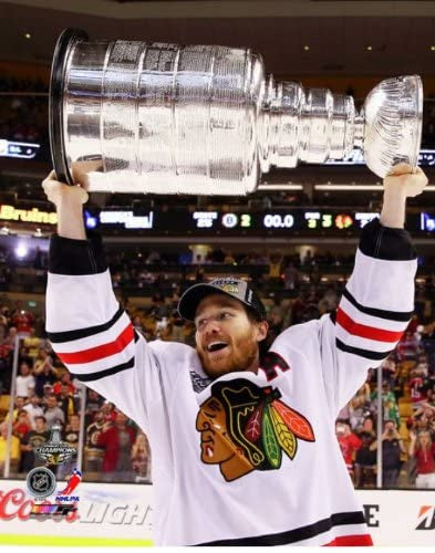 Duncan Keith Chicago Blackhawks 2013 Stanley Cup Champions Raising Of The Cup Photo - Pro Jersey Sports