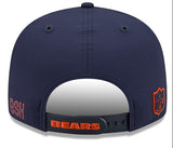 A navy blue Chicago Bears baseball cap shown from the back, featuring an adjustable strap with 'BEARS' in orange and red, along with team logos on the sides.