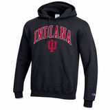 A black pullover hoodie featuring 'INDIANA' and the IU logo printed in red on the chest, with a small Champion logo on the left sleeve cuff, shown against a plain white background.