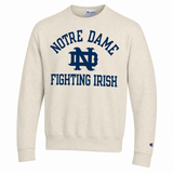 A cream-colored Champion crewneck sweatshirt featuring a navy blue graphic on the front that reads 'NOTRE DAME' above the 'ND' logo and 'FIGHTING IRISH' below, shown on a plain white background.
