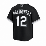 Black short-sleeve baseball jersey shown from the back, featuring 'MONTGOMERY' and the number '12' in white with black outlines, plus white sleeve trim. A small MLB logo is visible at the collar.
