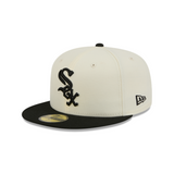 A New Era 59FIFTY fitted baseball cap in off-white and black, featuring the Chicago White Sox logo on the front and a black flat brim.